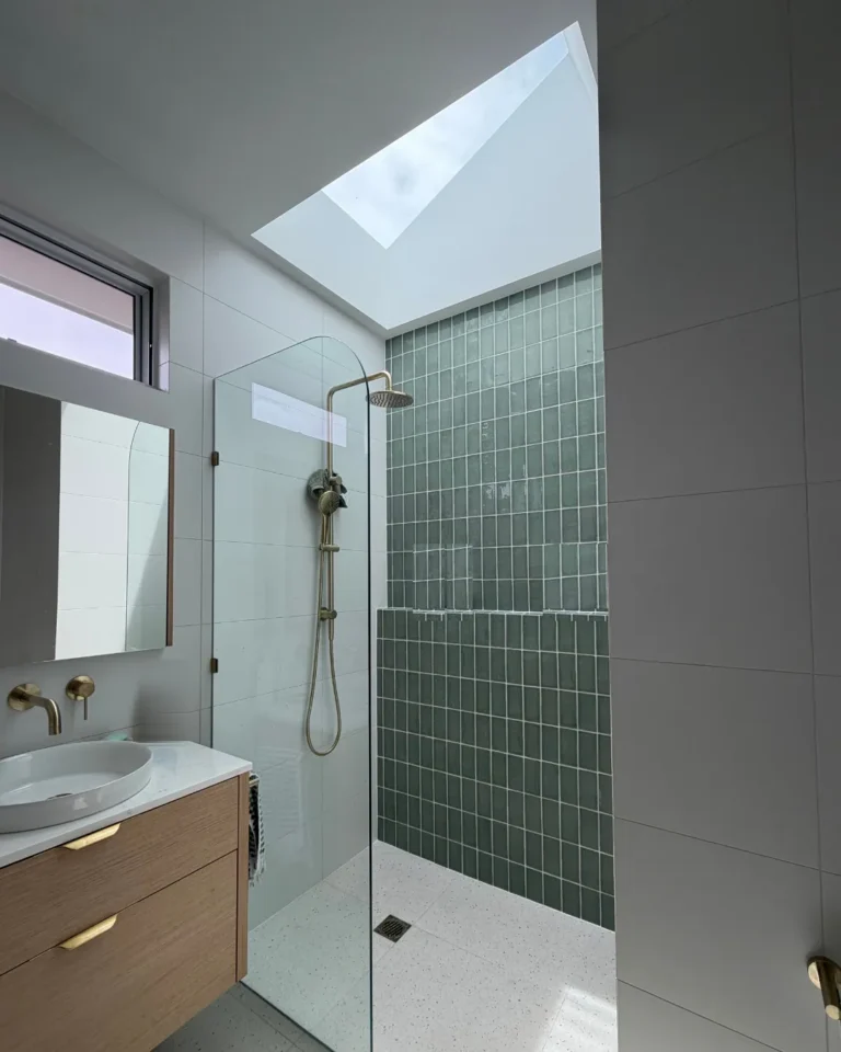 Ensuite with skylight and handmade green tile