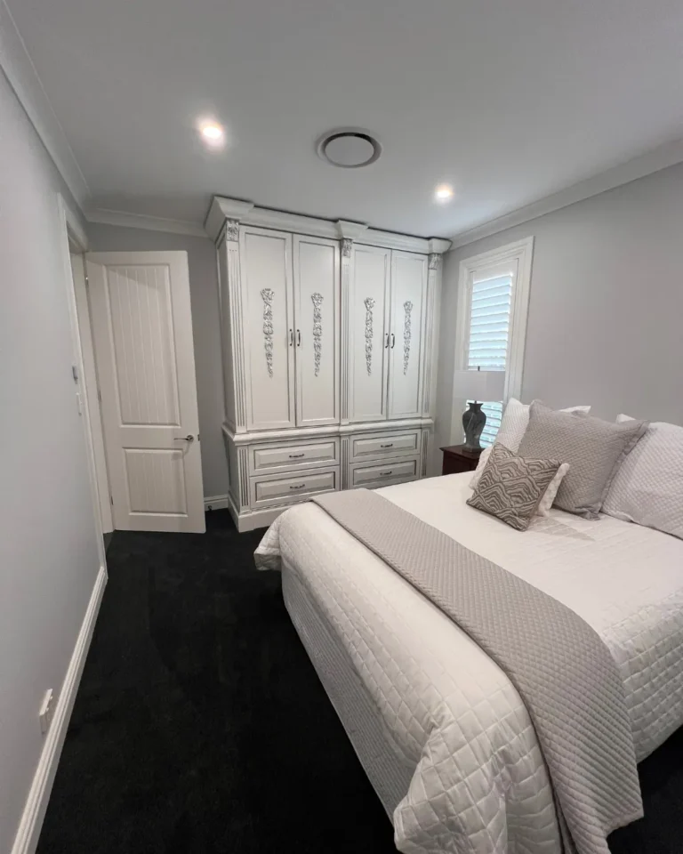 Guest bedroom with plantation shutters