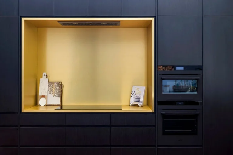 Full-height joinery with brass-lined niche