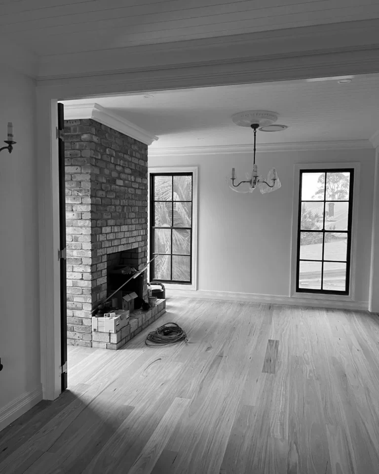 Living room and face-brick fireplace before handover
