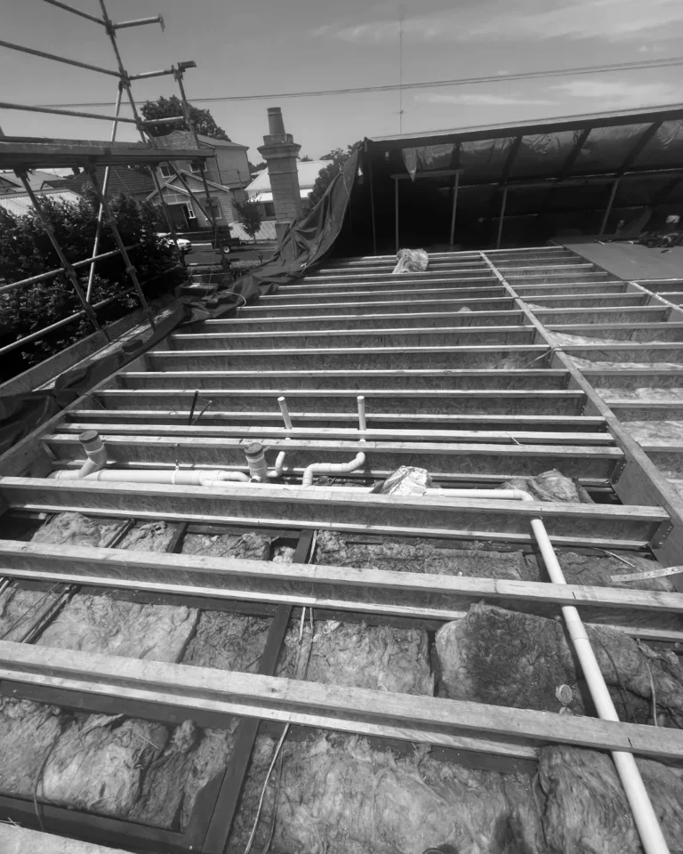 Second-storey addition — new floor framing and plumbing over the original ceiling